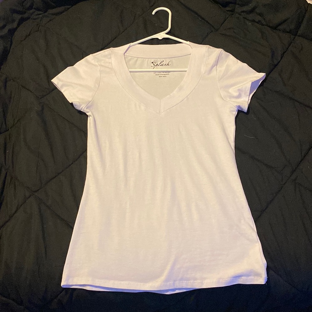 This is shirt. More on the tight fitting. Never worn.